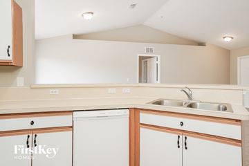 Lehigh Acres house for rent - A kitchen with a sink and cabinets.