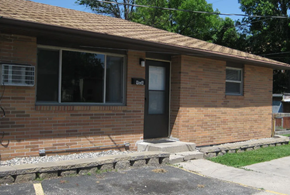 Moorhead house for rent - A brick house with a black door and windows.