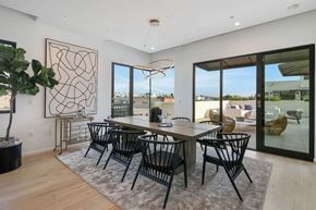 Beverly Hills apartment for rent - A modern dining room with a large table and chairs.
