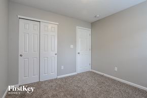 Shelbyville house for rent - a bedroom with two closets and two doors