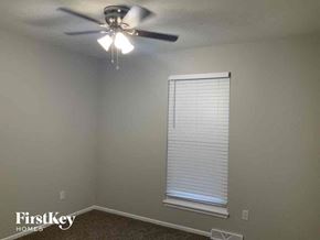 Independence house for rent - a living room with a ceiling fan and a window