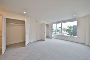Philadelphia apartment for rent - an empty living room with a large window and a closet