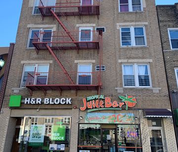 West New York apartment for rent - A building with a sign that says H&R Block.