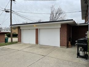 Kettering apartment for rent - a white garage door in front of a brick building