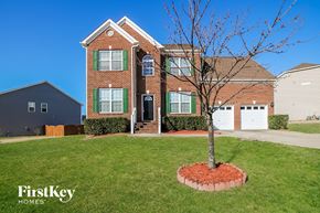 Fuquay-Varina house for rent - a house with a lawn and a tree in front of it