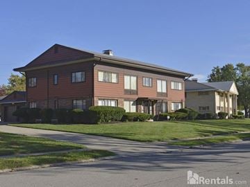 Kettering apartment for rent - a large brick house with a street in front of it