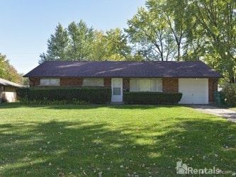 Kettering apartment for rent - A house with a green lawn in front of it.