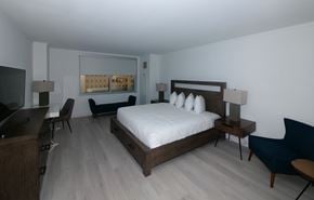 Atlantic City apartment for rent - A bedroom with a bed, desk, and chair.