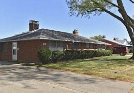 Kettering apartment for rent - A house with a red car parked in front.
