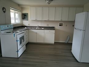 Kettering apartment for rent - A kitchen with white appliances and cabinets.