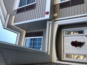 Laconia apartment for rent - a house with a white door and a wreath on it