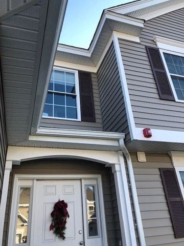 Laconia apartment for rent - a house with a white door and a wreath on it
