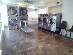 Pasadena apartment for rent - A laundry room with a washer and dryer in it.