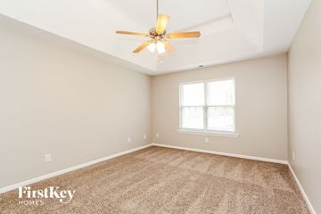 Mount Holly house for rent - the spacious living room with ceiling fan and carpet