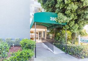 Oakland apartment for rent - A building with a green awning and the number 350 on it.