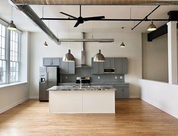 Chalfont apartment for rent - A modern kitchen with a large island and a ceiling fan.