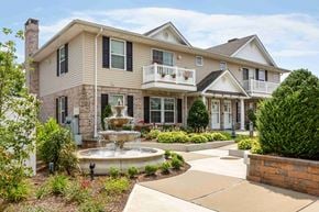 Lindenhurst apartment for rent - a fountain sits in front of a house