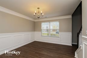 Denver house for rent - a dining room with white wainscoting and a window