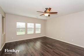 Fort Worth house for rent - a living room with wood flooring and a ceiling fan