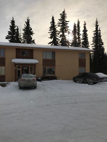 Soldotna apartment for rent - A building with a car parked in front of it.