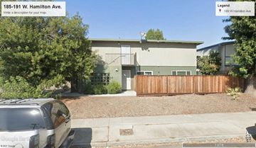 Campbell apartment for rent - a car parked in front of a house with a wooden fence