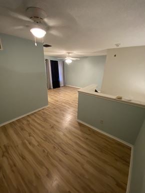 Lafayette house for rent - A room with wooden flooring and a white ceiling.