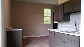 Cincinnati house for rent - A kitchen with a white counter top and a window.