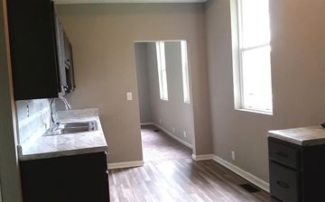 Cincinnati house for rent - A kitchen with a sink and a window.