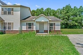 Jacksonville house for rent - A house with a grey roof and a white front door.