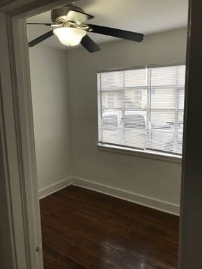 Lafayette apartment for rent - an empty bedroom with a ceiling fan and a window