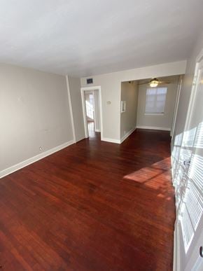 Lafayette apartment for rent - an empty living room with wood floors and a window