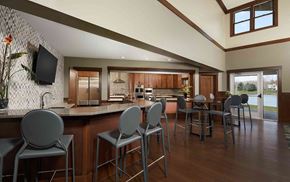 Grand Rapids apartment for rent - a large kitchen and dining room with a bar and chairs
