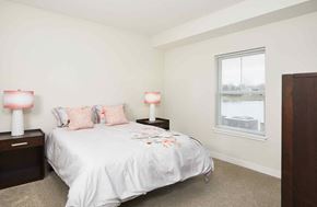 Grand Rapids apartment for rent - a bedroom with a bed and a window