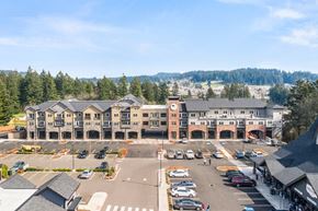 Happy Valley apartment for rent - an aerial view of an apartment complex with a parking lot