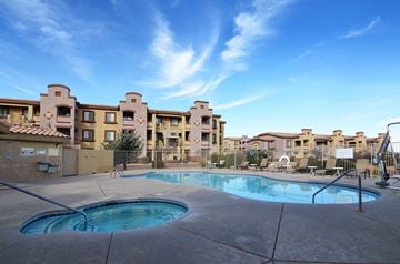 Sierra Vista apartment for rent - a swimming pool with an apartment building in the background