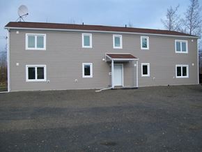 Fairbanks apartment for rent - A grey house with a white door and windows.