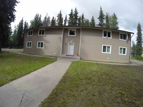 Fairbanks apartment for rent - A two-story house with a white door and windows.