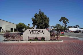Long Beach apartment for rent - the sign for victory business park in front of a parking lot
