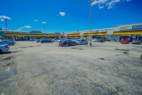 Hawthorne apartment for rent - the parking lot is empty in front of a gas station