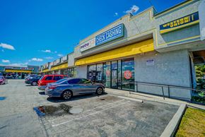 Hawthorne apartment for rent - a store with a row of cars parked in front of it