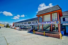 Torrance apartment for rent - the front of the crack fix building with cars parked outside