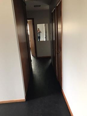 Cincinnati house for rent - a man taking a picture of himself in a mirror in a hall