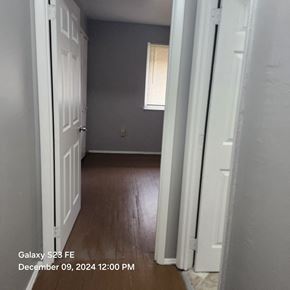 Cincinnati apartment for rent - A white door is open to a room with a window.