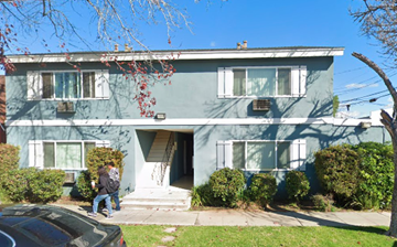Canoga Park apartment for rent - a blue house with two people walking in front of it