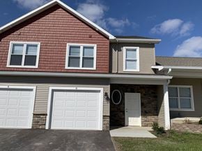 Penn Yan apartment for rent - a brown house with a white garage door