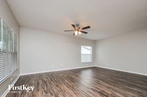 Riverview house for rent - A room with a ceiling fan and wooden flooring.