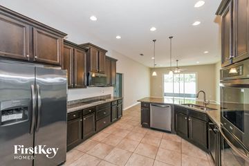 Jacksonville house for rent - A kitchen with a refrigerator and a sink.
