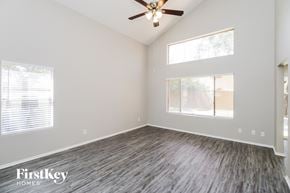 Chandler house for rent - the living room of a new home with wood floors and a ceiling fan