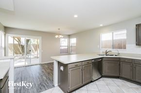 Chandler house for rent - a kitchen with a white counter top and a sink