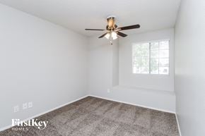 Chandler house for rent - the bedroom has a carpeted floor and a ceiling fan